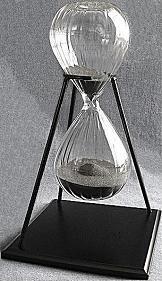 Wedged Glass Sand Timer With Stand. Black Sand